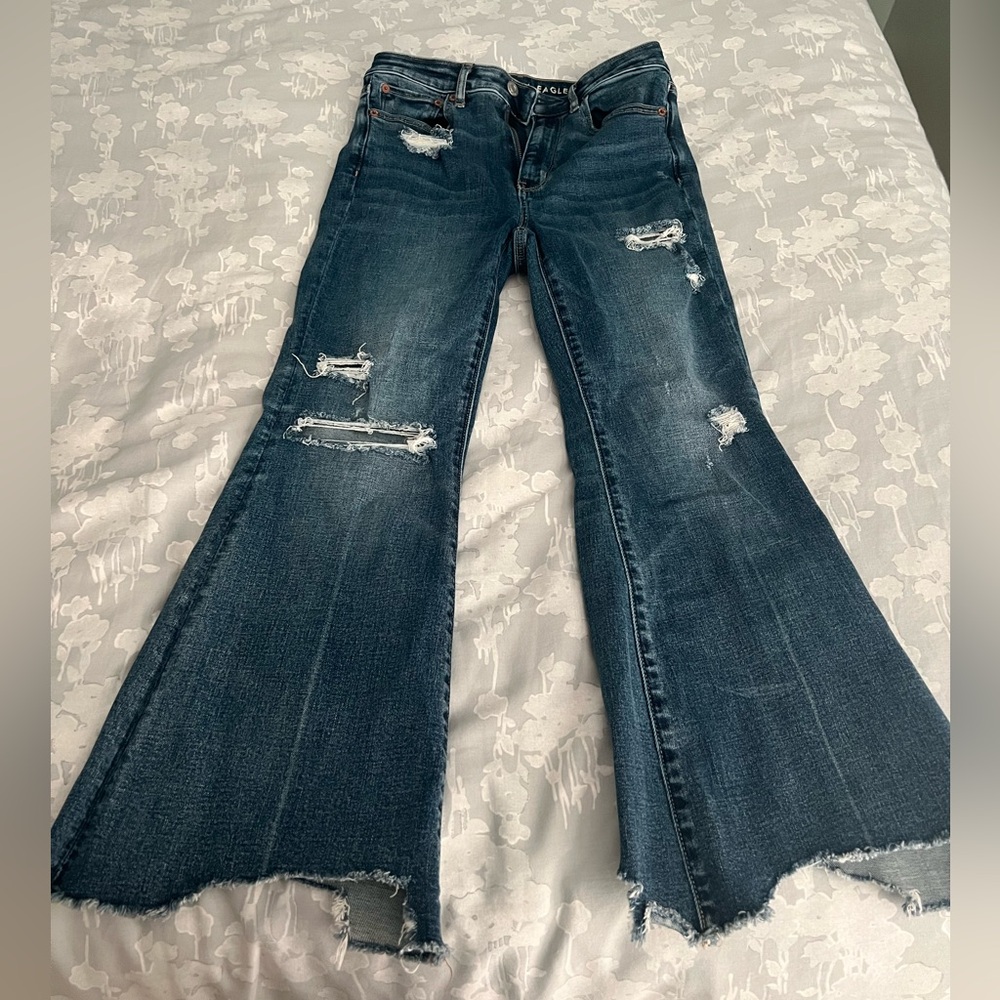 American Eagle super high rise crop flare jeans ripped dark wash distressed.